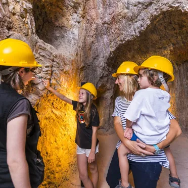 family enjoying a cultural visit inside a mine